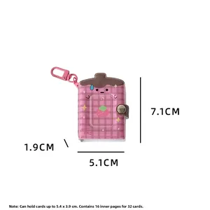 Detail of pink plaid strawberry card holder with a metal hook for ID photos