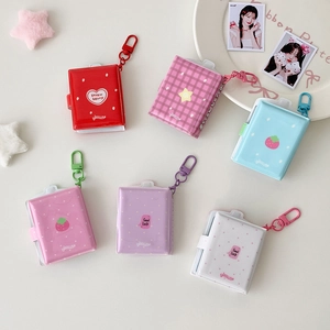 Mini PVC binder photo albums with star keychains in various cute pastel colors