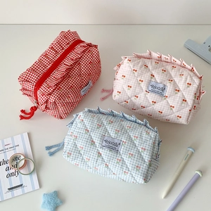 Three assorted quilted cherry pattern storage bags in red, blue and pink colors