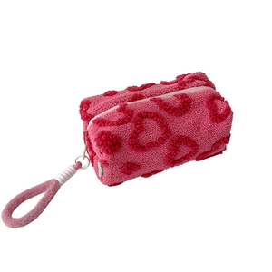 Pink heart quilted plush cosmetic bag with fleece hand strap for skincare and makeup