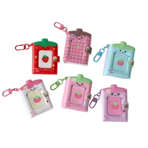 Cartoon strawberry card holders in six vibrant colors with cute faces and hanging clips
