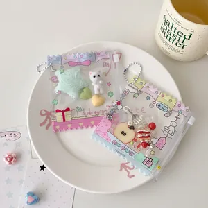 Detailed view of PVC candy bag card holders with cute accessories and heart graphics