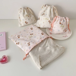 Set of four drawstring bags featuring cute bear and floral prints in beige and pink