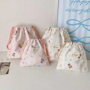 Set of four cute cartoon bear and flower drawstring storage bags for cosmetics and sundries