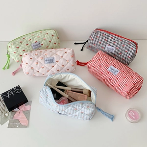 Quilted fabric stationery bags with cherry print in five pastel colors for storage