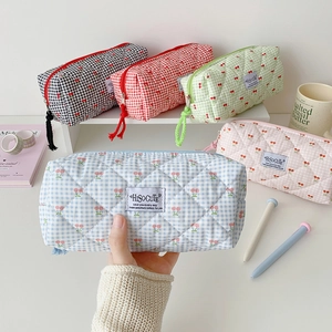 Quilted cherry embroidered cosmetic and stationery bags in various checkered pastel colors