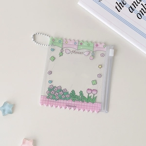 Detail view of transparent PVC storage bag with floral cartoon print and bead chain