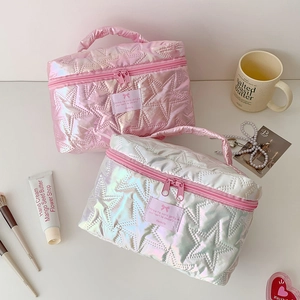 Quilted star pattern cosmetic bag with laser finish and bow detail in pink and silver