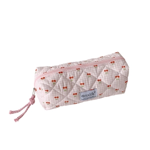 Cute cherry print quilted pencil case with pink plaid pattern and soft fabric texture