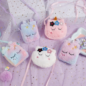Flat lay of five colorful plush unicorn crossbody bags with sequins and embroidery