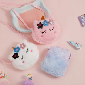 Detailed view of plush unicorn crossbody purses with embroidery and sequin flower accents