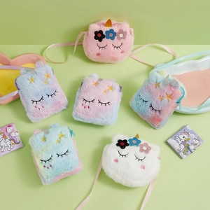 Flat lay of colorful plush unicorn crossbody bags with soft fur and glitter horn detail