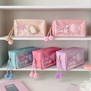 Sparkly heart sequin makeup bags in macaron colors with plush pompom zippers