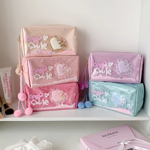 Sparkly heart sequin stationery pouch with fluffy pompom zipper charm in five pastel colors