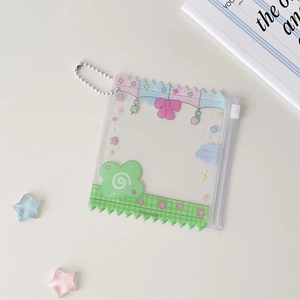 Close-up of clear PVC candy bag card holder with colorful wavy edges and star decorations
