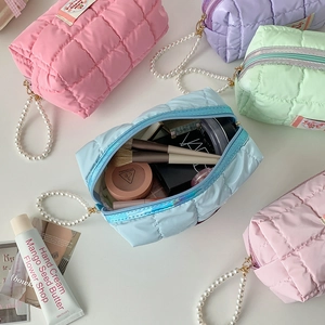 Quilted macaron color makeup pouch with pearl handle and spacious interior storage
