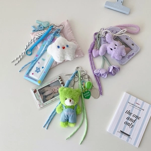 Detailed set of cute plush doll keychains with ID card holders in blue, purple, and green