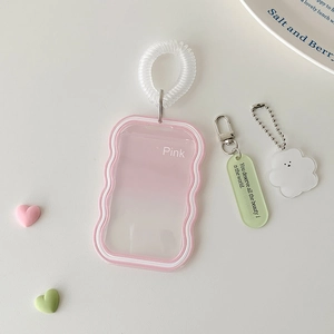 Pink wavy silicone card holder with cloud charm and green translucent pendant detail