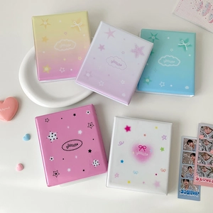 Flat lay of macaron-colored photocard albums with yisocute cloud and heart designs