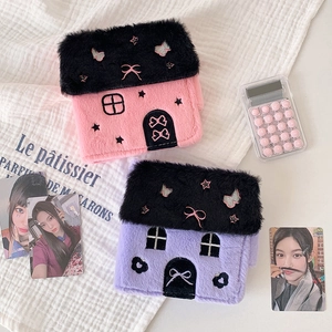 Detail of plush house-shaped photo card holders with delicate butterfly and star embroidery