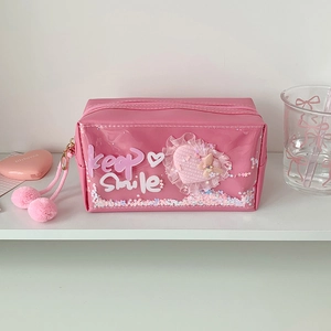 Macro detail of pink glitter pencil case featuring quicksand sequins and Keep Smile text