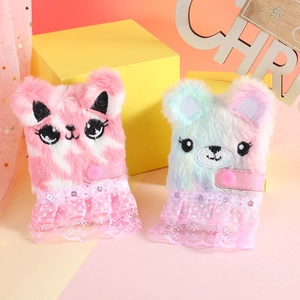 Detail of plush animal notebooks featuring pink texture, lace trim, and sequin closure