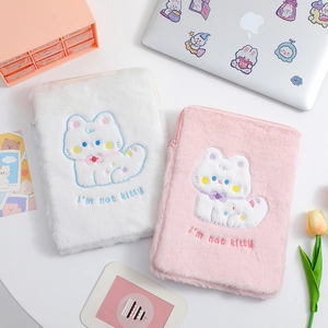 Detail of cute plush tablet sleeve showing intricate cat embroidery and soft zipper closure