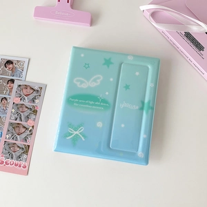 Mint green 4-grid photo album cover with white wings and star patterns for k-pop cards