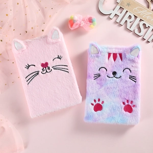 Detail of plush cat diary notebooks with soft faux fur and embroidered cat faces