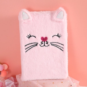 Detailed close-up of pink fluffy cat journal with 3D ears and glittery embroidery accents