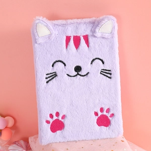 Detail of cute purple plush cat diary with soft faux fur and embroidered cat paw detail