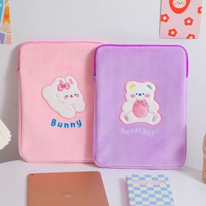 Close-up of cute plush iPad sleeve with high-quality 3D embroidery and smooth zipper