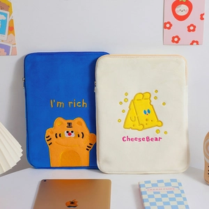 Close-up of cute cartoon tiger and bear embroidery on plush padded tablet sleeves
