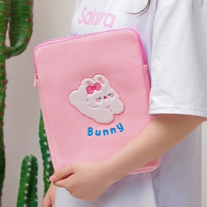 Detail of pink plush iPad case with cute white rabbit embroidery and Bunny text