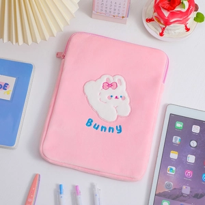 Pink plush tablet sleeve featuring cute bunny embroidery and soft faux fur texture