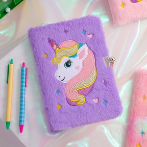 Detailed close-up of purple plush unicorn A5 diary featuring embroidery and silver metal lock