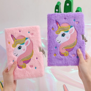Detail of plush unicorn A5 diary set with soft fur covers and metal lock buckles