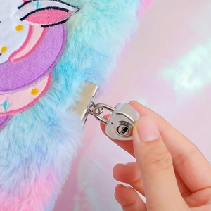 Close-up of fuzzy unicorn diary with heart-shaped metal lock and rainbow plush texture