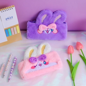 Detail of plush rabbit pencil cases in pink and purple with soft 3D bunny ears