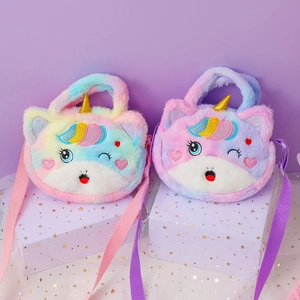 Detail of plush unicorn bag with golden horn, embroidery, and woven shoulder strap