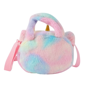 Close-up of rainbow plush unicorn bag with golden sequins and adjustable pink strap