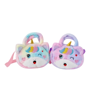 Detailed close-up of colorful plush unicorn bags with gold horns and embroidery
