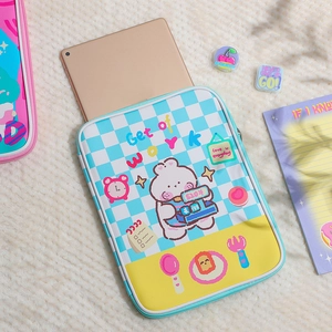 Detail of cute rabbit tablet sleeve showing gold iPad fit and blue checkerboard design