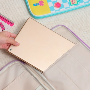 Internal view of purple cartoon iPad sleeve with multi-compartments for 11-inch tablet