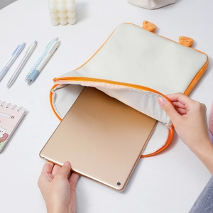 Cute plush toast tablet sleeve with ears for 11 inch iPad on a bright desk
