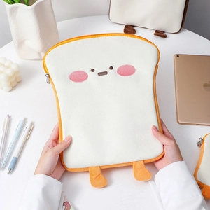 Close-up of cute plush toast laptop sleeve with soft embroidery and 3D feet for 11 inch iPad