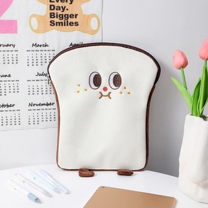 Detail of plush toast tablet sleeve featuring cute cartoon embroidery and small feet