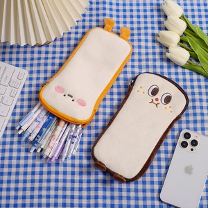 Close-up of cute toast plush pencil cases with soft fabric and embroidered faces