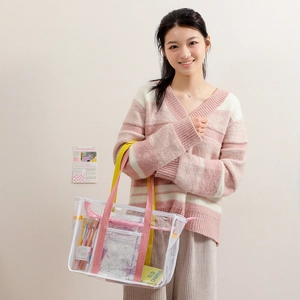 Clear cartoon PVC tote bag with colorful handles and mesh detail for beach or storage