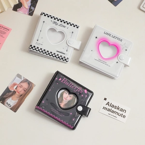 Three Korean style mini binder photo albums with heart window and side snap closure
